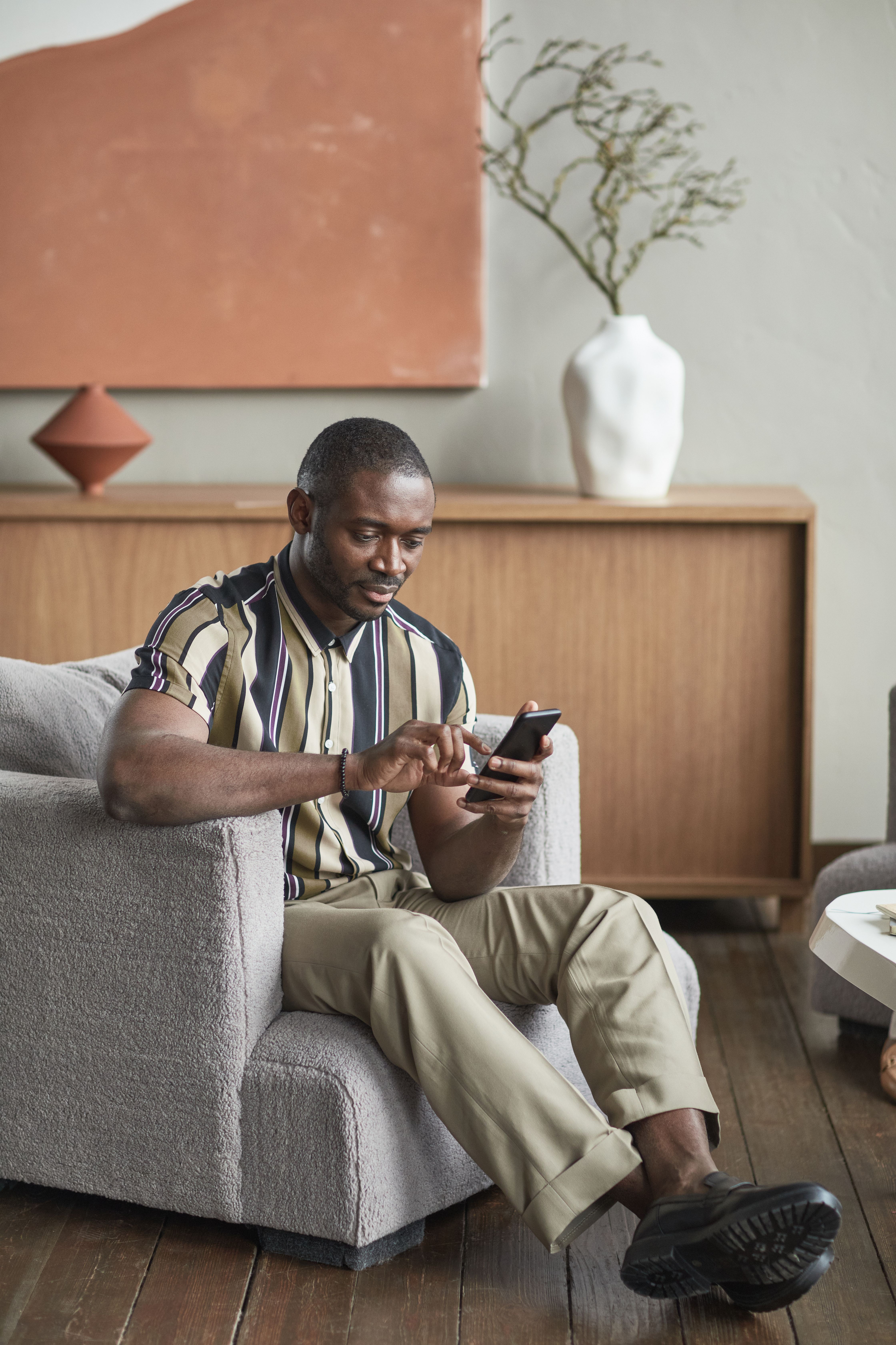 Tenant browsing apartments on phone